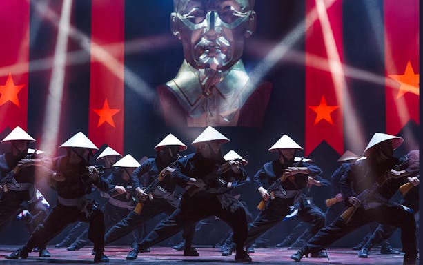 Performers in traditional hats during Miss Saigon at The Sydney Opera House.