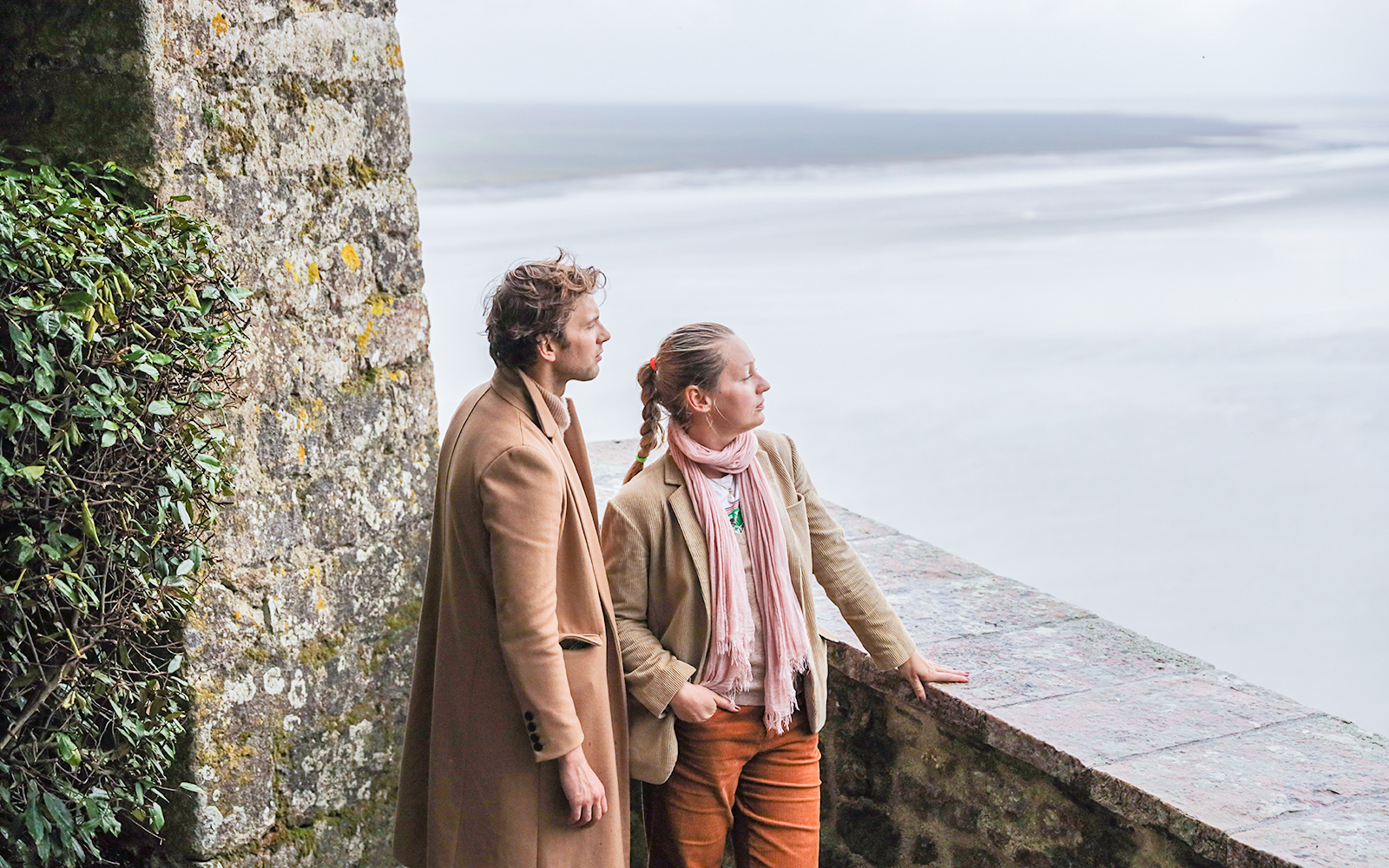 Couple enjoying the view from Mont Saint-Michel during a private tour from Paris.
