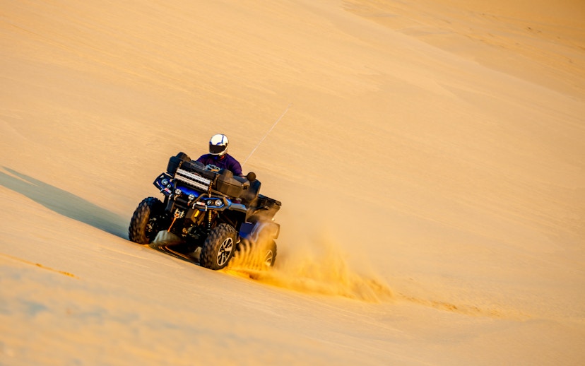 Quadbike riding on sand dunes in Doha, Qatar.