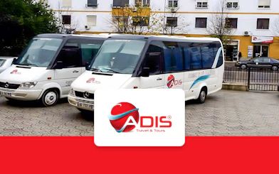Buses for Tirana Airport transfer to Durres parked outside.