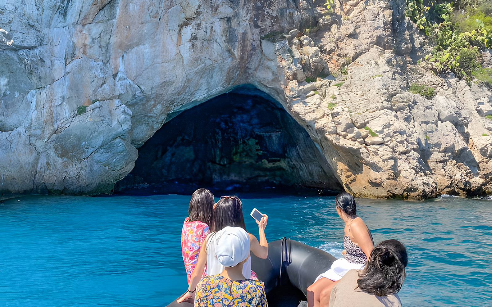 Boat approaching sea cave on Nice to Monaco tour.