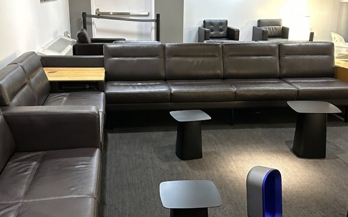 Seating area in HelloSky Lounge at JFK Airport Terminal 4, New York.