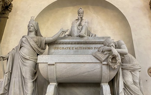 Santa Croce monument in Florence featuring statues and inscriptions.