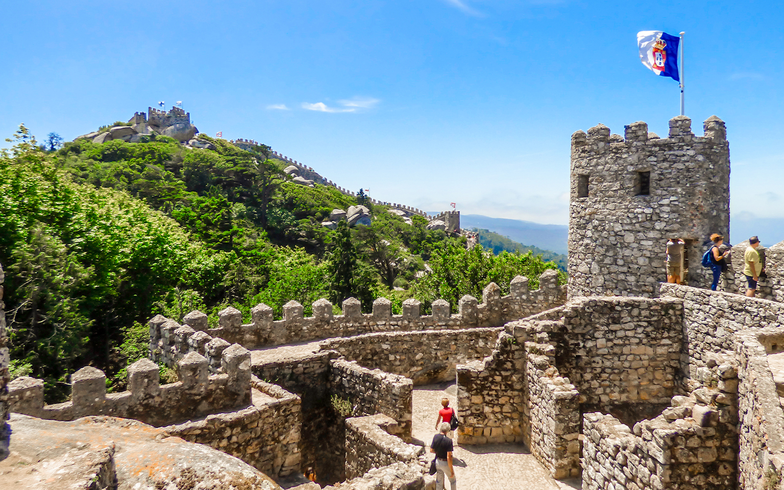 Walls of the Moorish Castle with Pena Palace in the background, Sintra, Portugal.