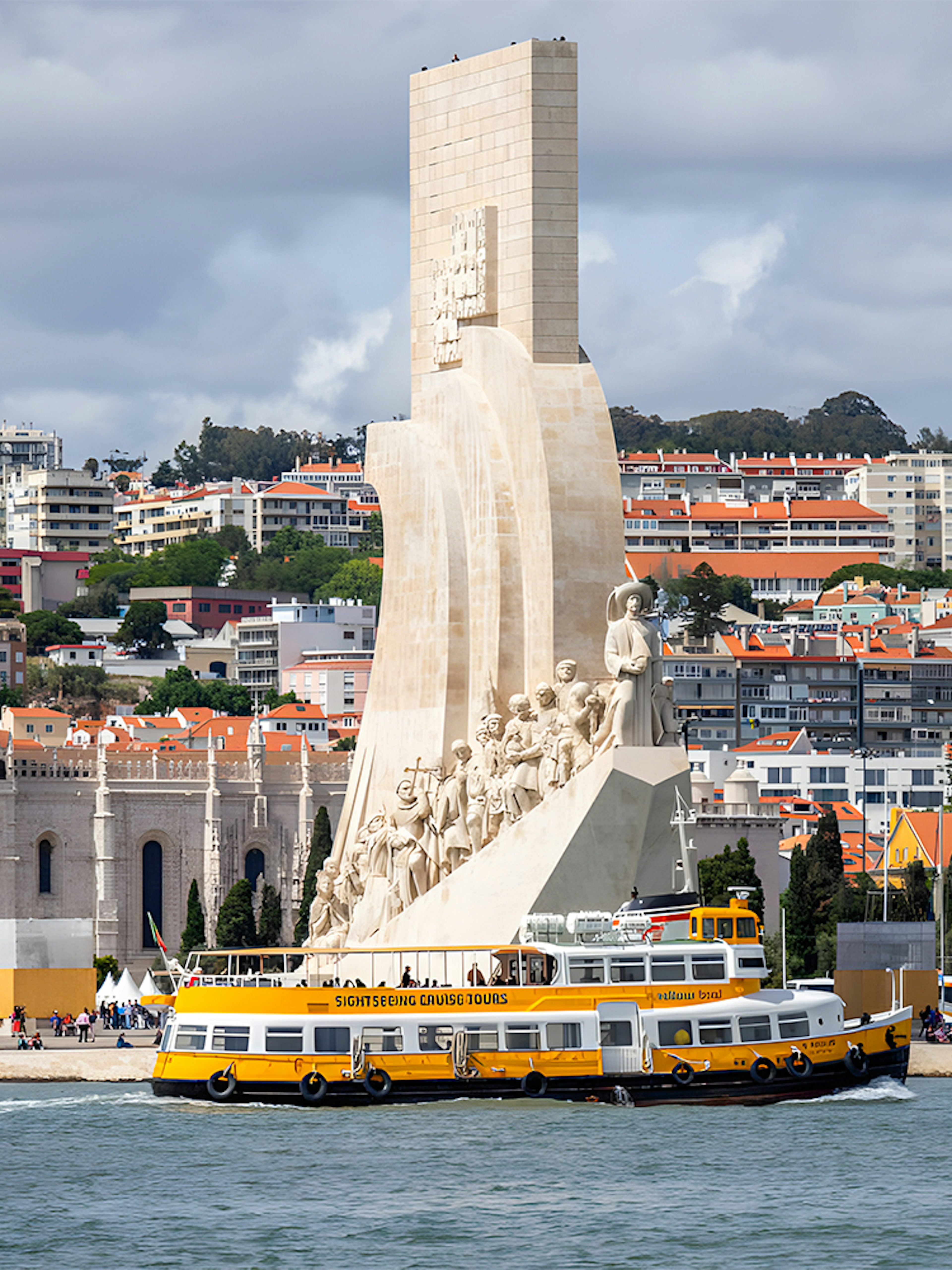 Monument of Discoveries with Yellow Boat HOHO tour in Lisbon.