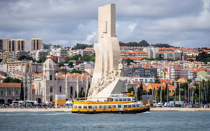 Monument of Discoveries with Yellow Boat HOHO tour in Lisbon.