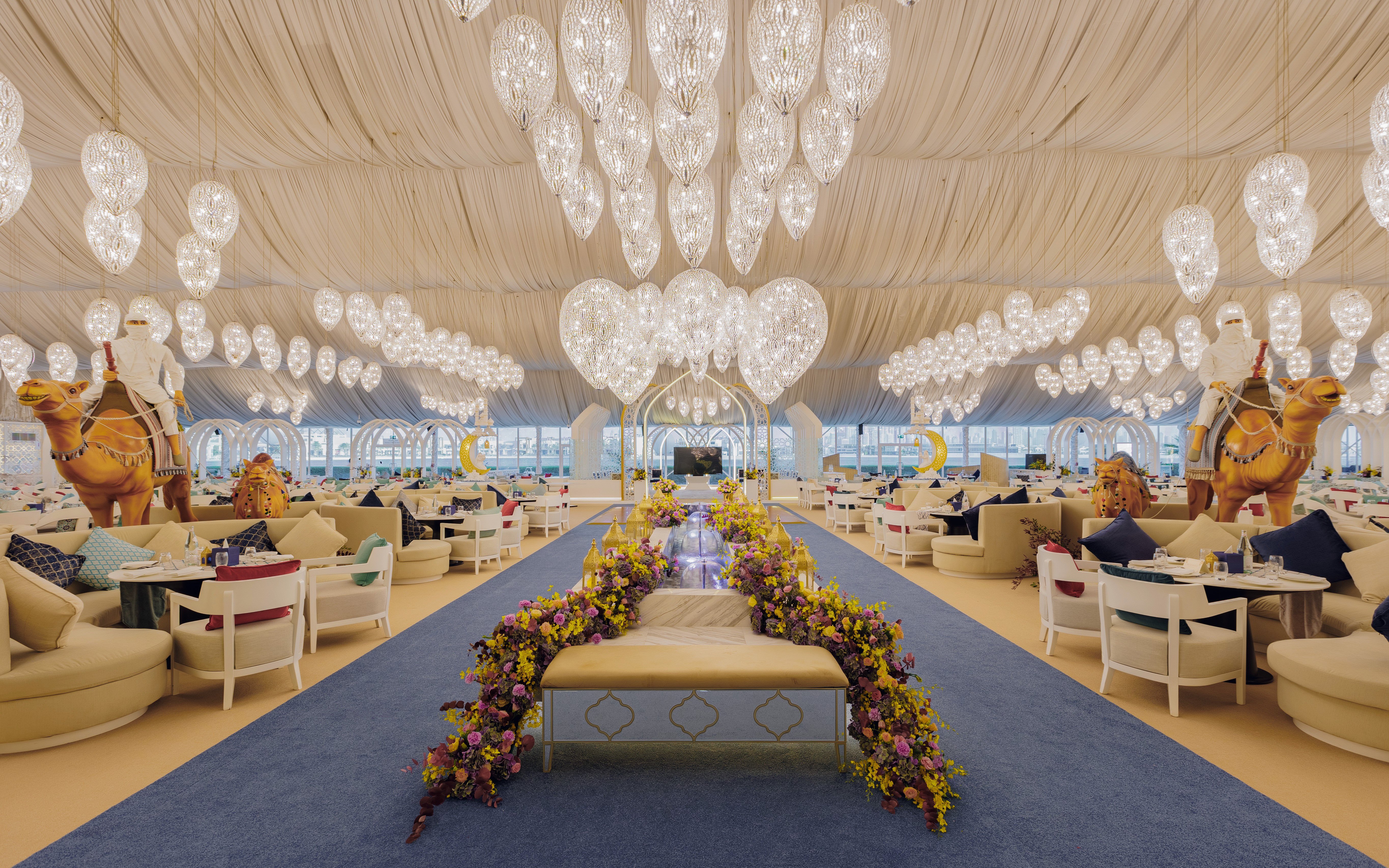 Dining tables set up inside Asateer Tent for Iftar at Atlantis, The Palm, Dubai during Ramadan.
