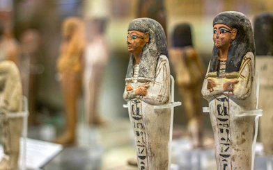 Ancient Egyptian figurines displayed at the National Museum of Egyptian Civilization in Cairo.