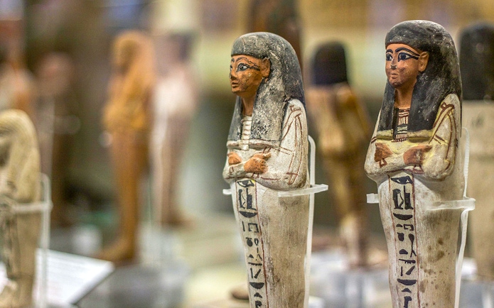 Ancient Egyptian figurines displayed at the National Museum of Egyptian Civilization in Cairo.