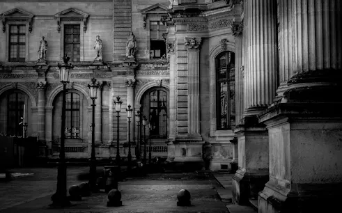 Historic Parisian architecture with statues and lampposts on a guided walking tour.
