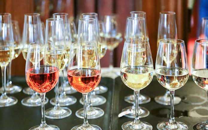 Glasses of red and white wine on a table during Mornington Peninsula winery tour.