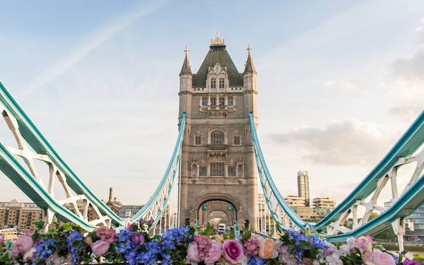 Tower Bridge in London with floral foreground.