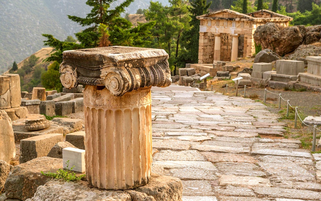 Ancient column and ruins at Delphi, Greece.