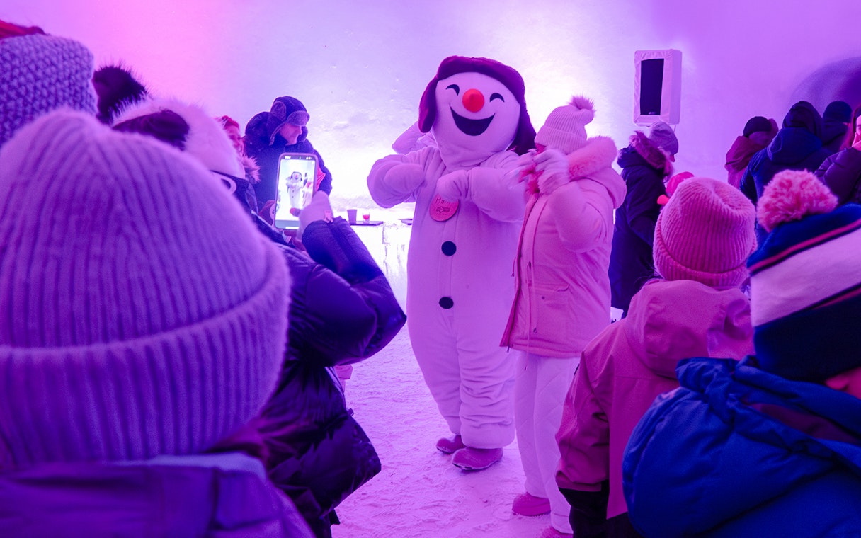 Snowman character entertaining visitors at Snowman World, Santa Claus Village.
