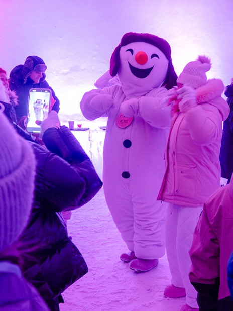 Snowman character entertaining visitors at Snowman World, Santa Claus Village.