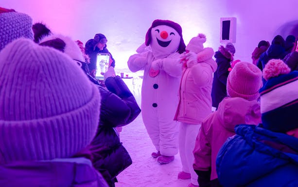 Snowman character entertaining visitors at Snowman World, Santa Claus Village.