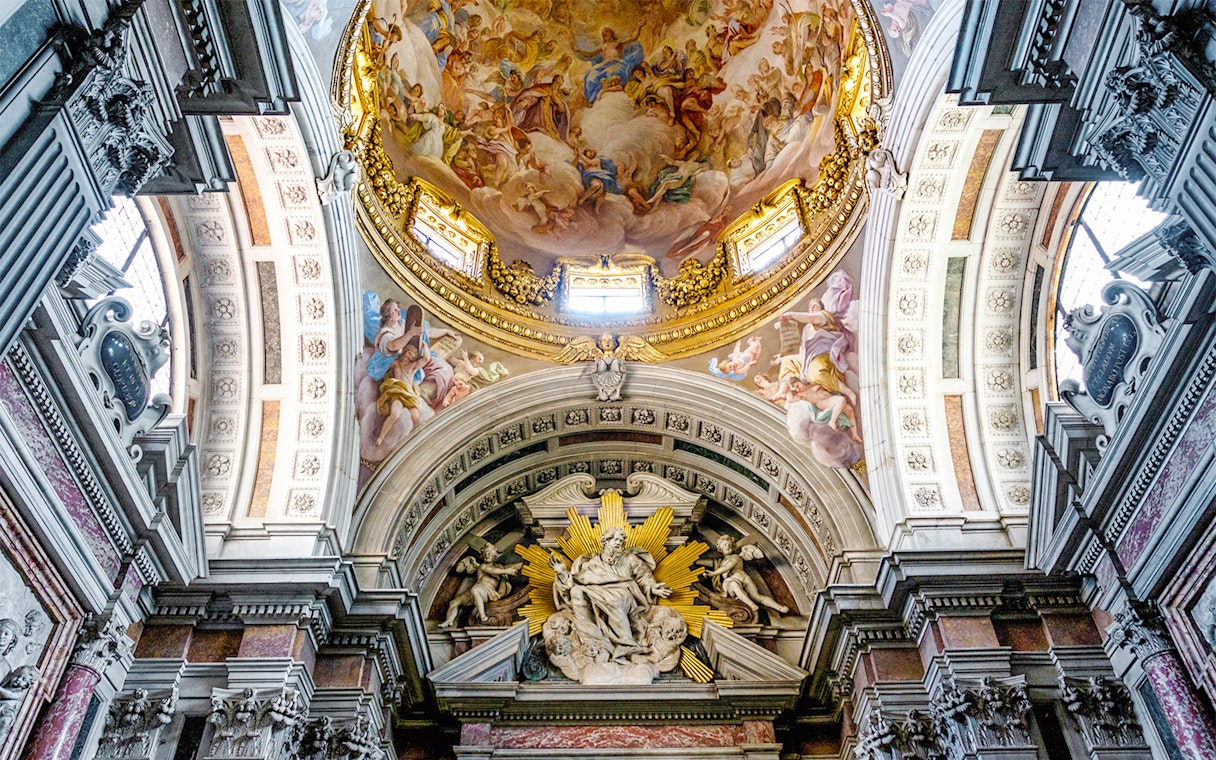 Brancacci Chapel ceiling with detailed frescoes and ornate architecture in Florence, Italy.