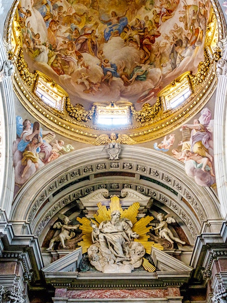 Brancacci Chapel ceiling with detailed frescoes and ornate architecture in Florence, Italy.