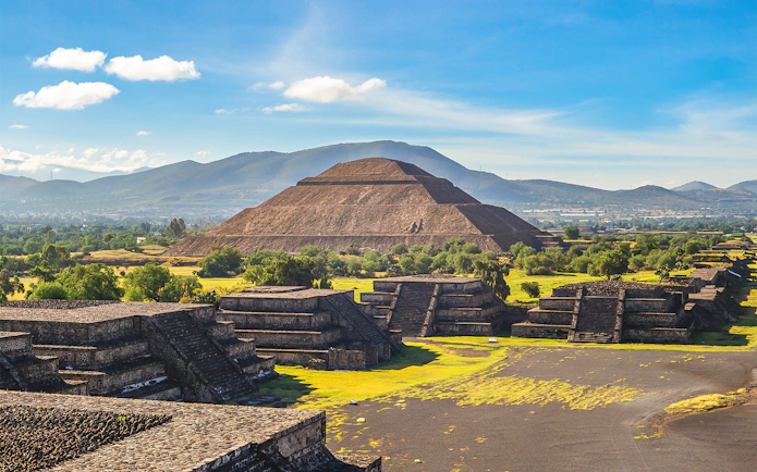 Pyramid of the Sun in Teotihuacan, Mexico, with surrounding ancient structures.