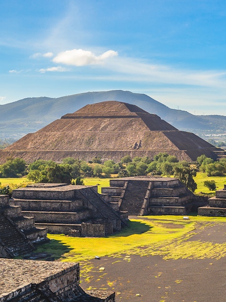 Pyramid of the Sun in Teotihuacan, Mexico, with surrounding ancient structures.