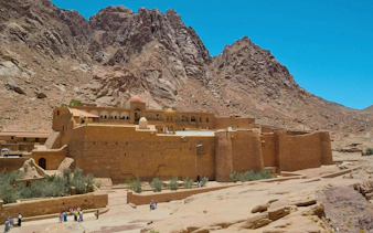 Monastery of St. Catherine with mountains and olive trees, South Sinai, Egypt.