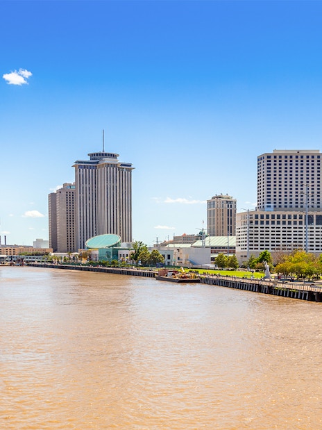 New Orleans skyline with business district skyscrapers viewed from Mississippi River, Louisiana.