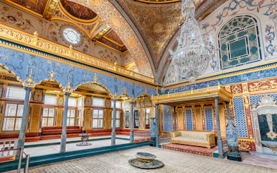 Topkapi Palace ornate interior with chandeliers and intricate wall designs, Istanbul.