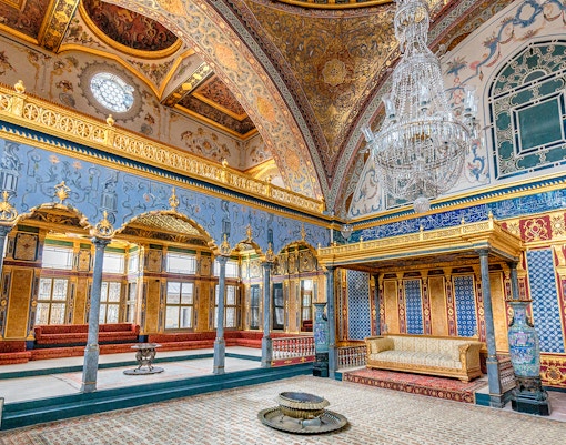 Topkapi Palace ornate interior with chandeliers and intricate wall designs, Istanbul.