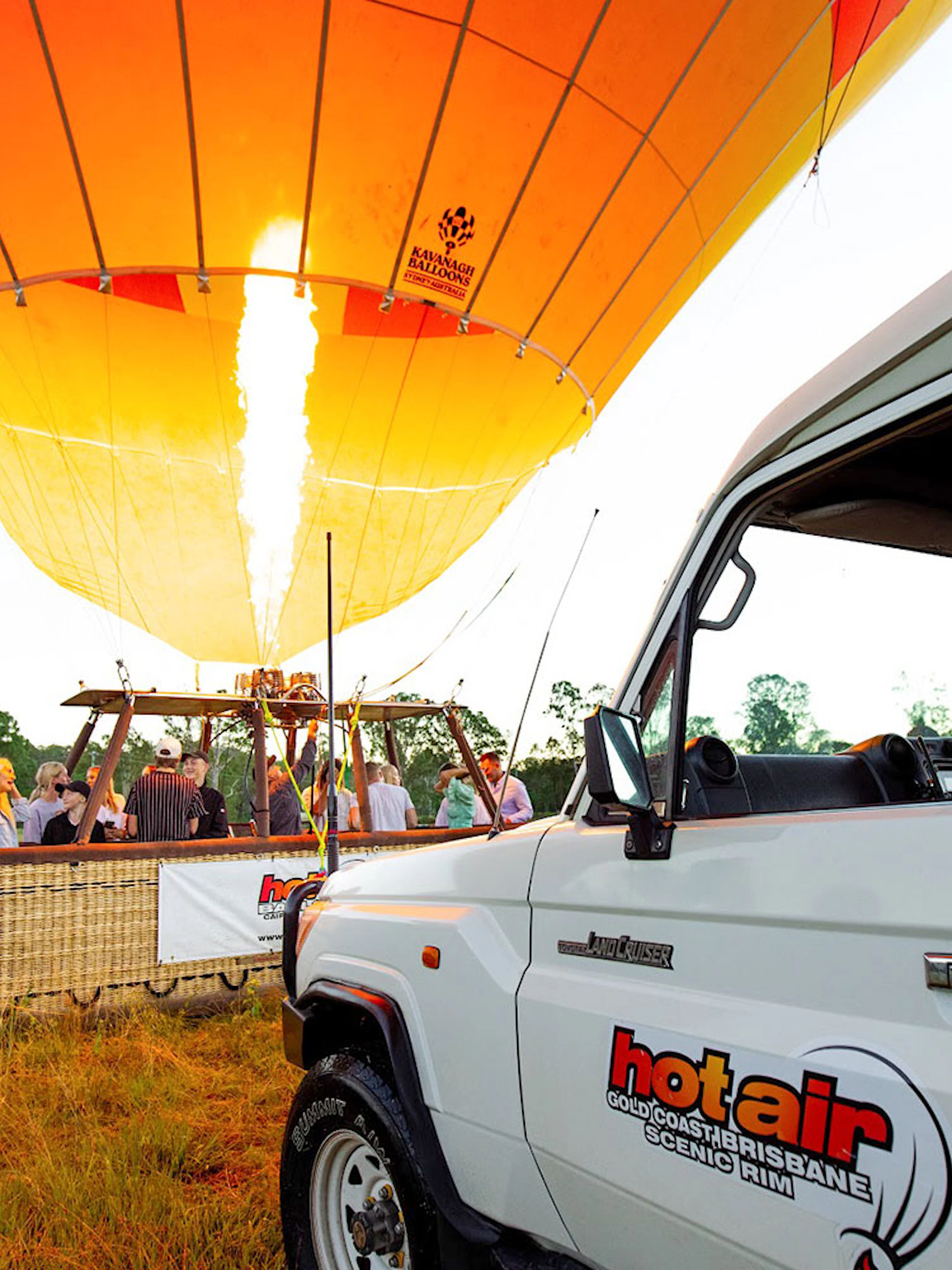 Hot air balloon preparing for flight in Brisbane with passengers boarding.