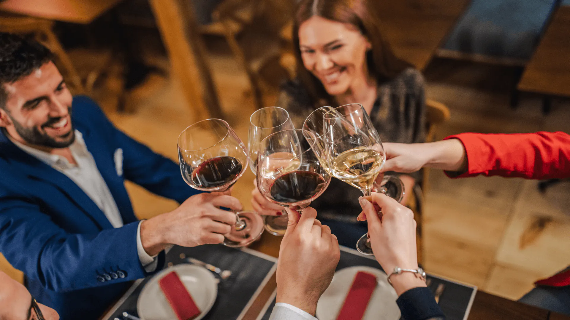 Group toasting with wine glasses during Brazilian wine tasting in Rio de Janeiro.