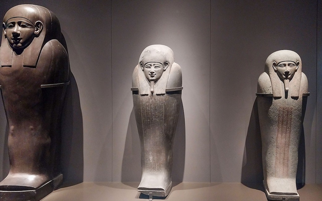 Ancient Egyptian sarcophagi on display at the Grand Egyptian Museum.