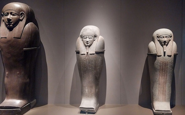 Ancient Egyptian sarcophagi on display at the Grand Egyptian Museum.