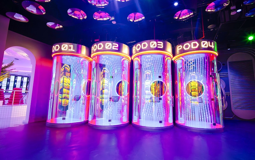 Interactive pods with neon lights at House of Hype, Dubai.