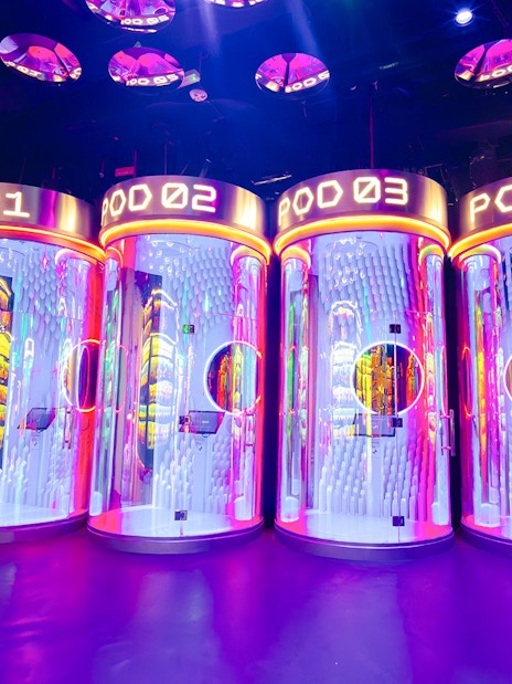 Interactive pods with neon lights at House of Hype, Dubai.