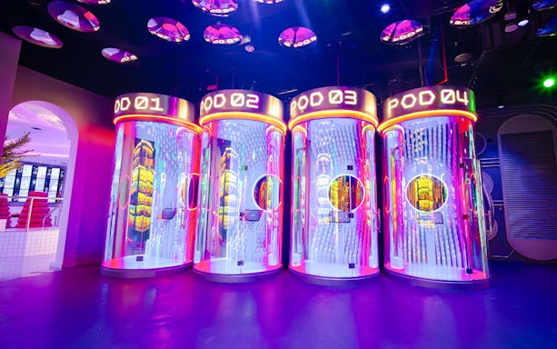 Interactive pods with neon lights at House of Hype, Dubai.