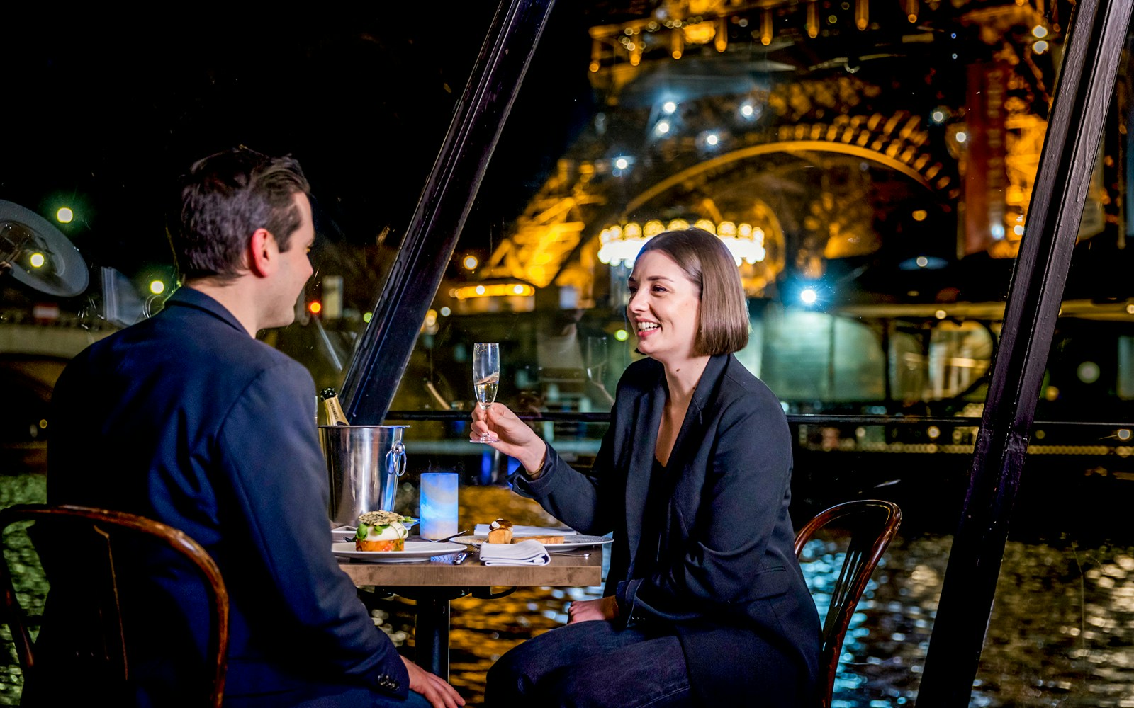 Seine River dinner cruise on La Marina with Eiffel Tower and Paris skyline in view.