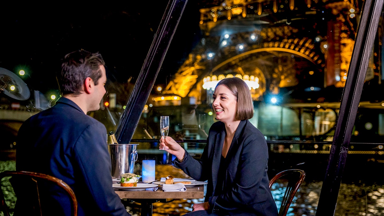 Seine River dinner cruise on La Marina with Eiffel Tower and Paris skyline in view.