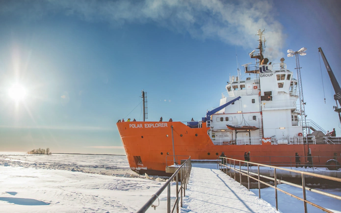 Icebreaker ship Polar Explorer docked on frozen sea in Rovaniemi.