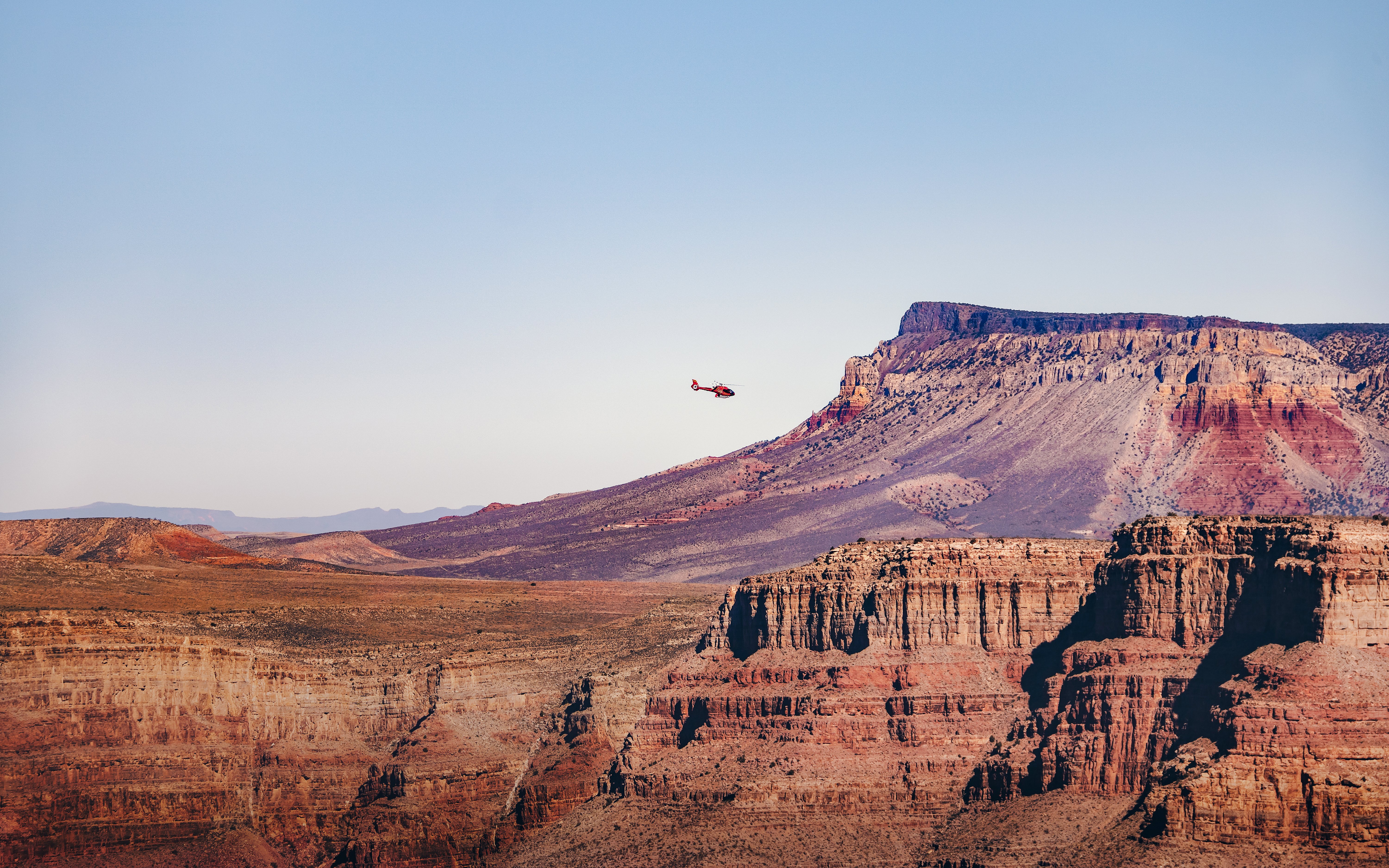 Helicopter flying over Grand Canyon West Rim, Arizona.