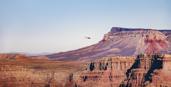Helicopter flying over Grand Canyon West Rim, Arizona.