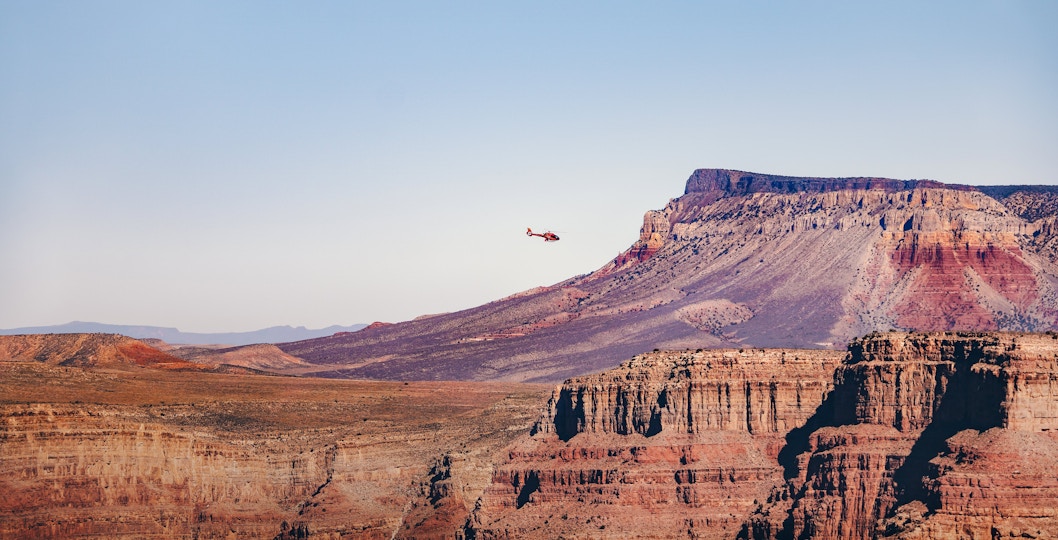 Helicopter flying over Grand Canyon West Rim, Arizona.