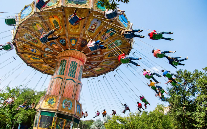 Swing ride at Six Flags Mexico with people enjoying the attraction.