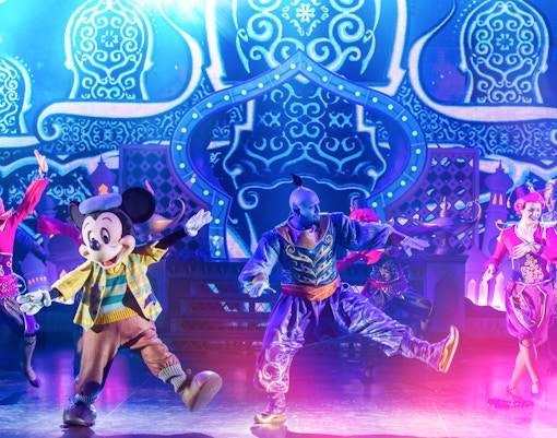 Mickey Mouse performing in a Disneyland Paris parade show.