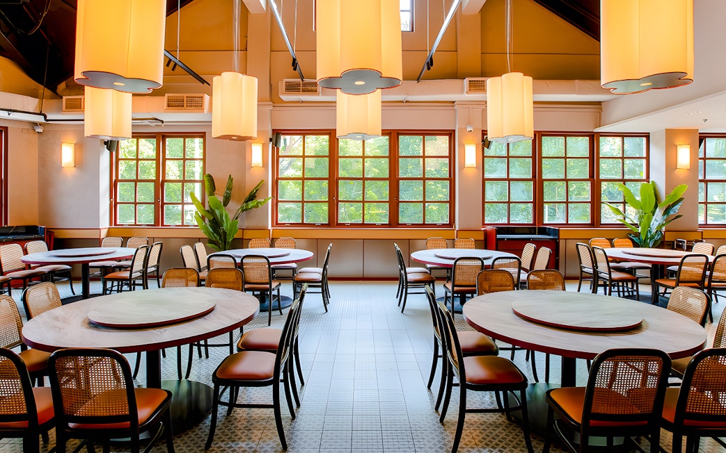 Interiors of House of Seafood restaurant, Clarke Quay, Singapore with round tables and chairs.