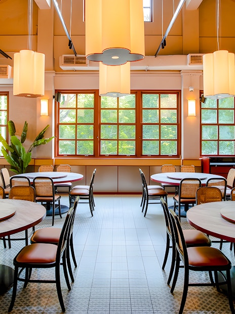 Interiors of House of Seafood restaurant, Clarke Quay, Singapore with round tables and chairs.