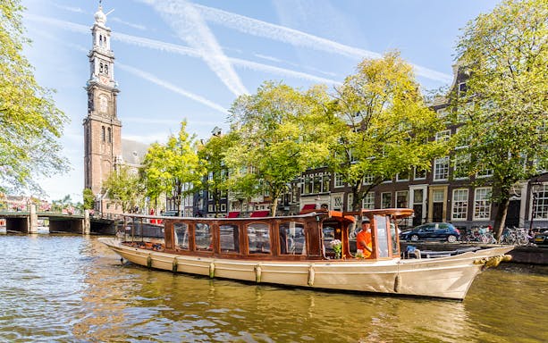 Tall ships sailing in Amsterdam harbor during SAIL Amsterdam event.