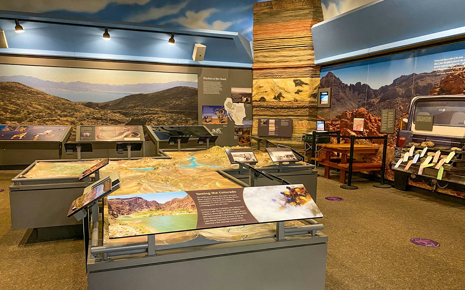 Exhibit showcasing Colorado River and desert landscape at Hoover Dam visitor center.