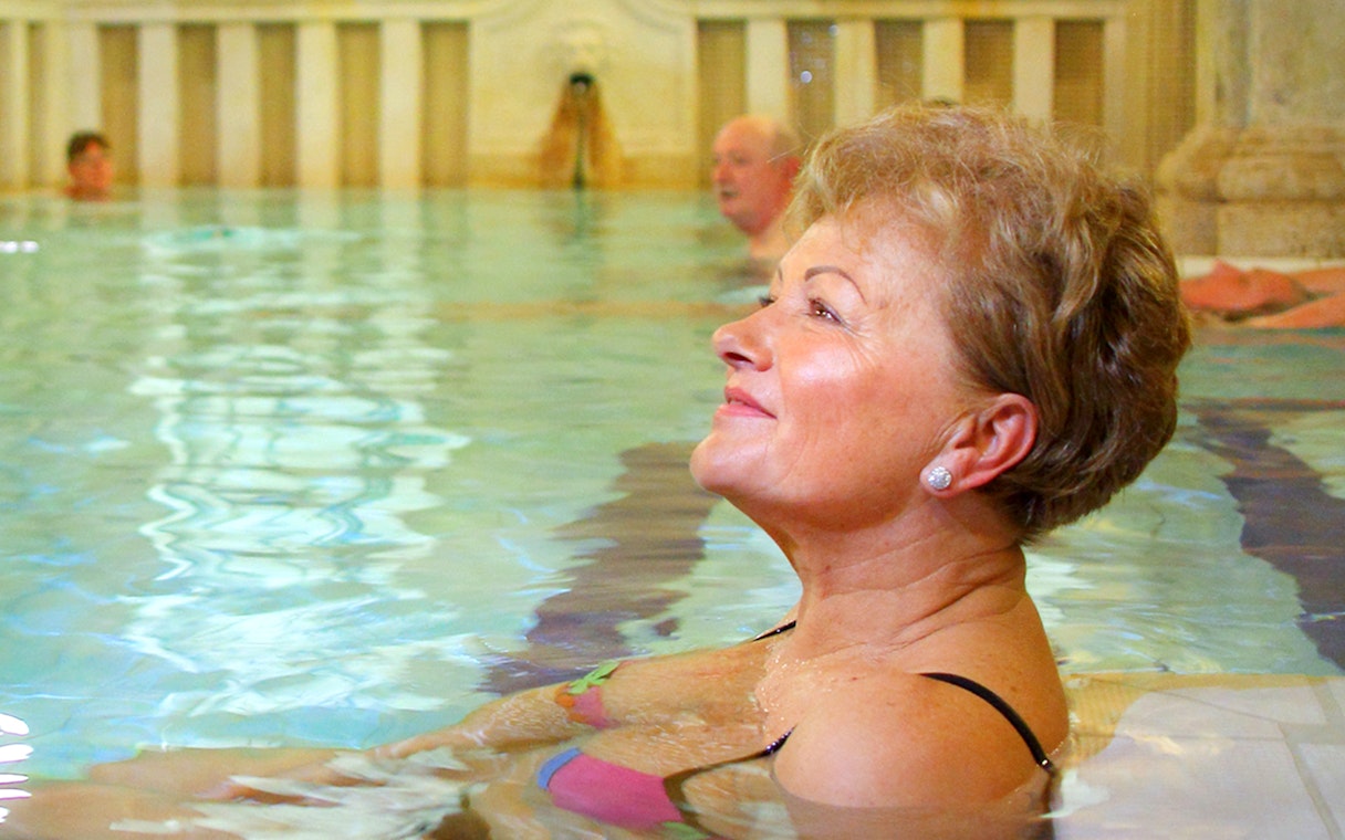 Guests enjoying indoor pools at Lukacs Spa.