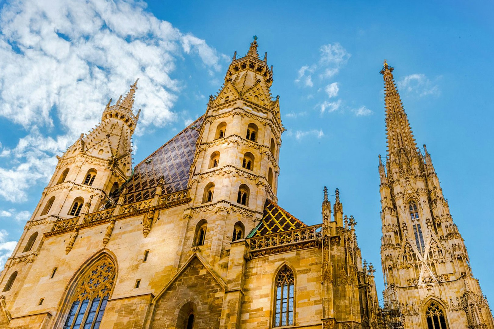 St. Stephen's Cathedral towers against a blue sky in Vienna, Austria.