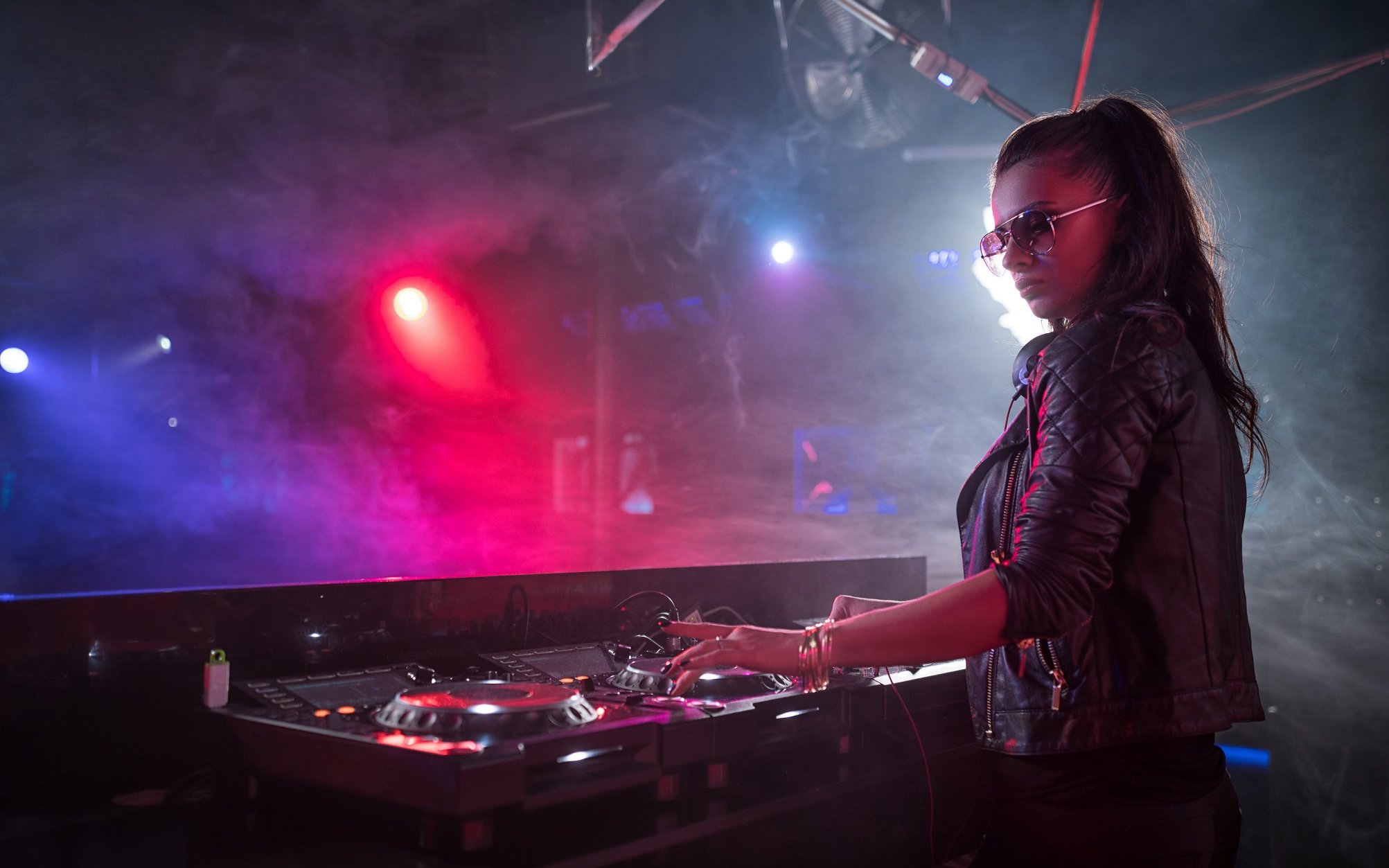 DJ performing at Night Splash event, SplashMania Waterpark.